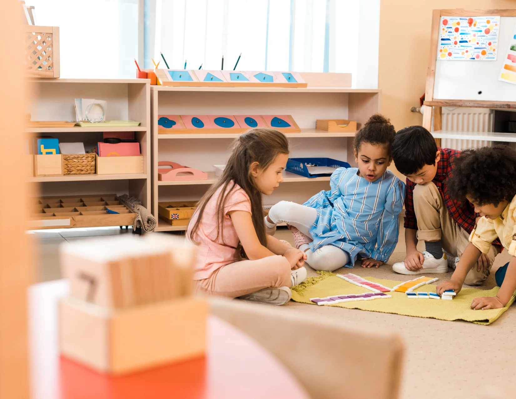Children working together with Montessori materials